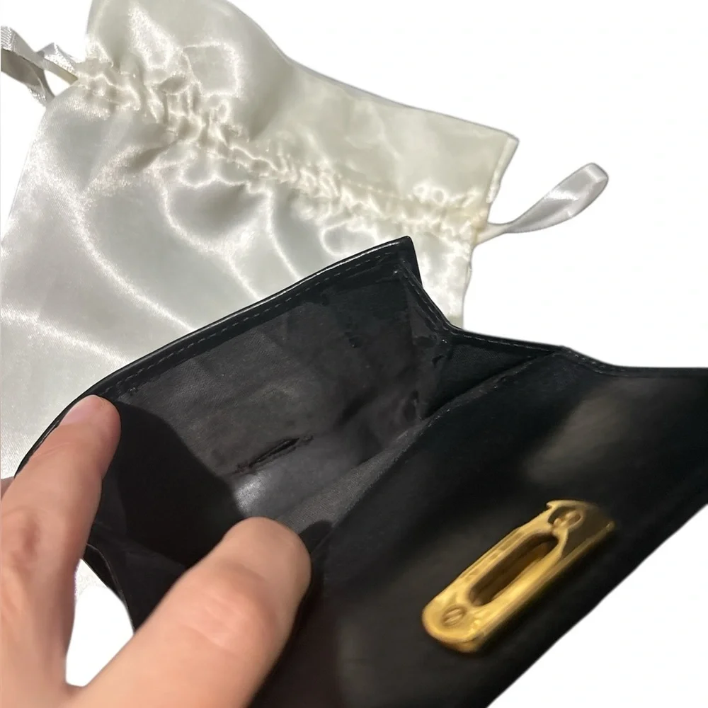 Authentic Ferragamo black leather trifold wallet gold with callouts